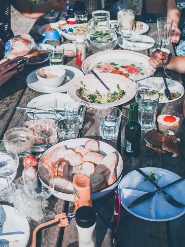 a table with varied plates of food on it 